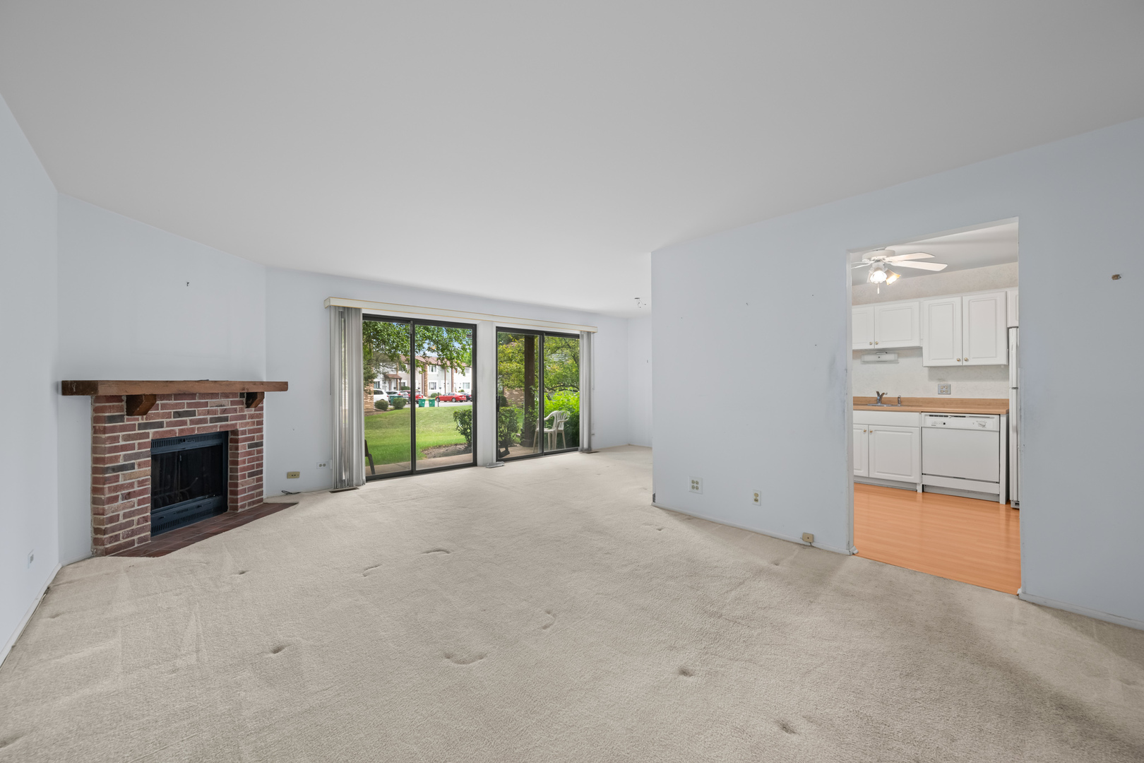 1542 Springview Court, Unit B1 Wheeling, IL 60090 - Photo 5 of 14 a view of empty room with a fireplace and entryway