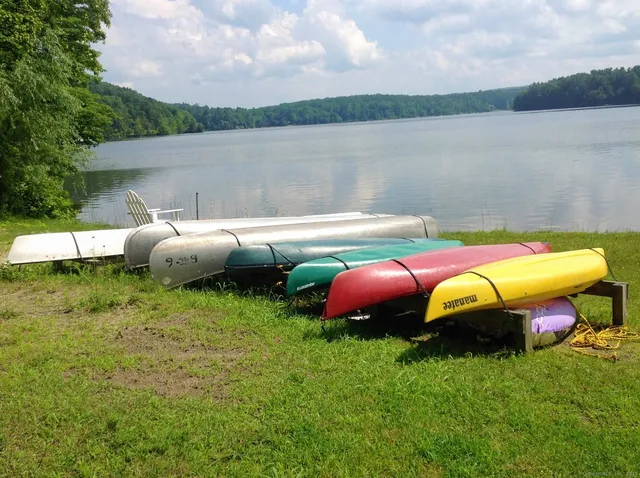 a view of yard with swimming pool and outdoor seating