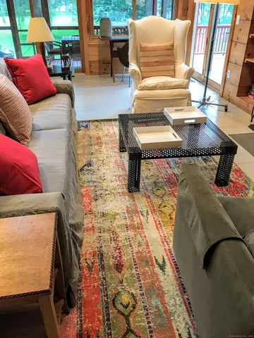 a living room with furniture and a rug