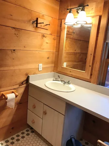 a bathroom with a sink and a mirror