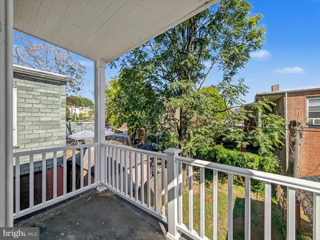 a view of balcony with small garden