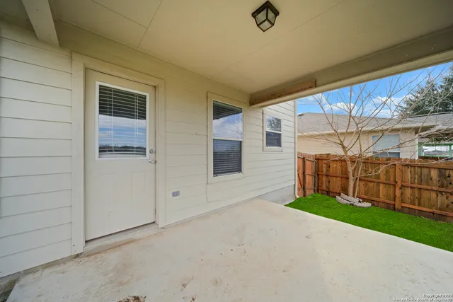 a view of backyard with small cabin