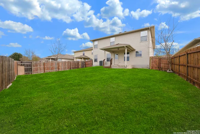 a view of a house with a big yard