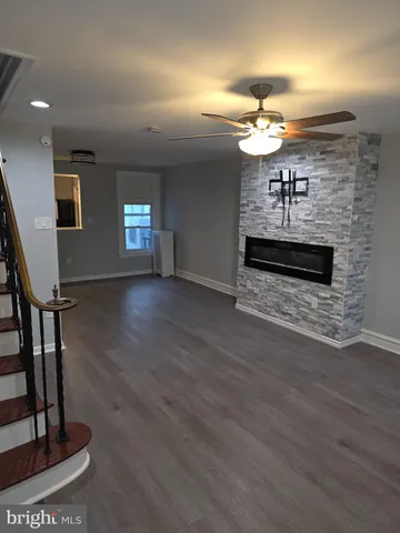 wooden floor in a hall with a window