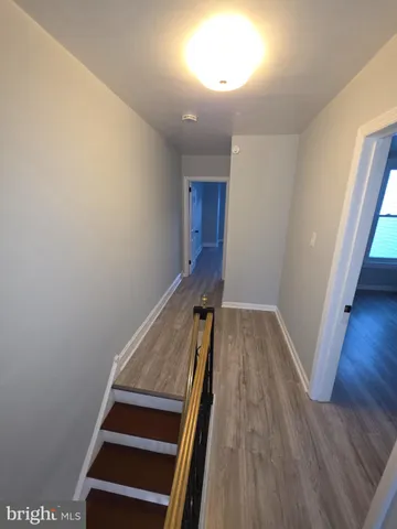 a view of entryway with wooden floor