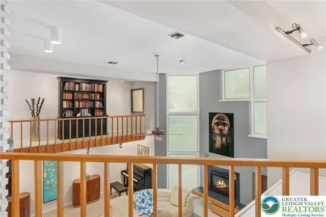 a view of an entryway with wooden floor and windows