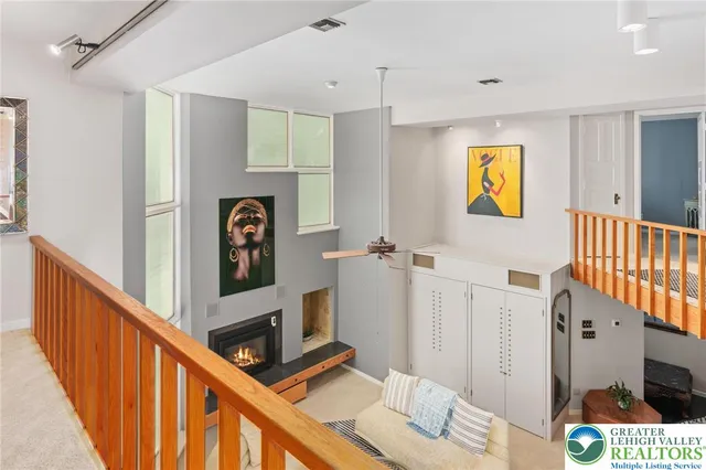 a hallway with a dining table and chairs