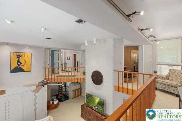 a living room with a couch a table and a large window