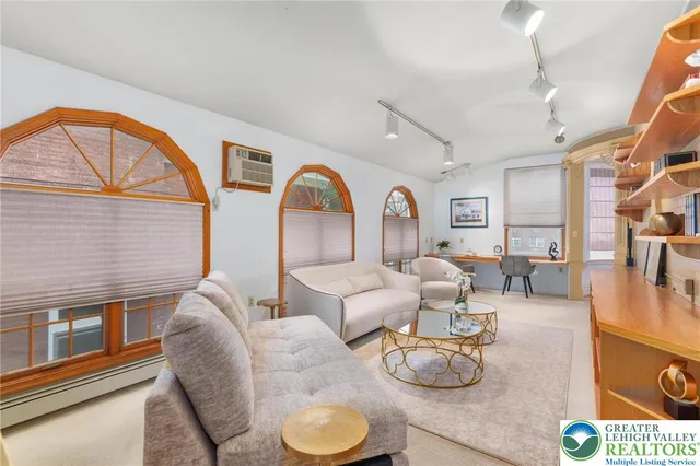 a room with furniture and a potted plant