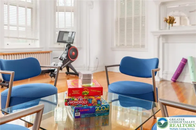 a bedroom with a large bed and a potted plant