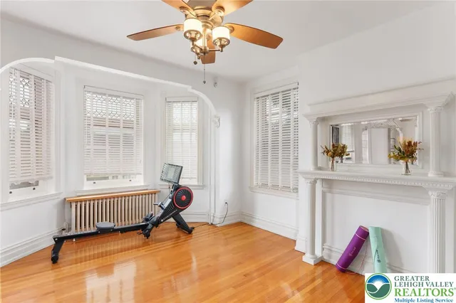 a bedroom with a bed and a table