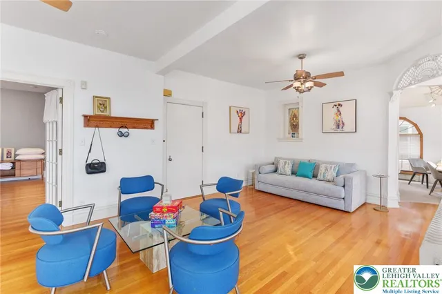 a view of a dining room with furniture and wooden floor