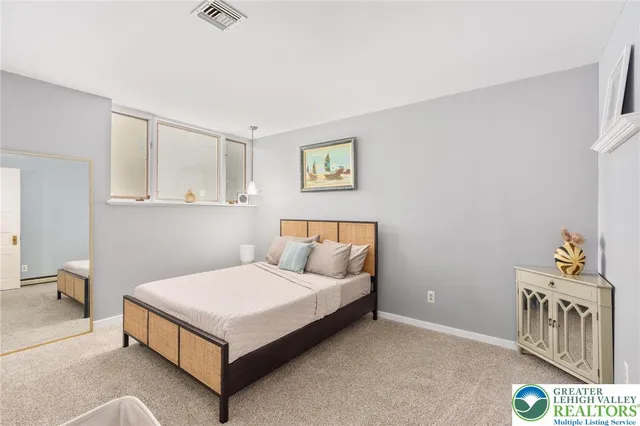 a bathroom with a sink toilet and a mirror