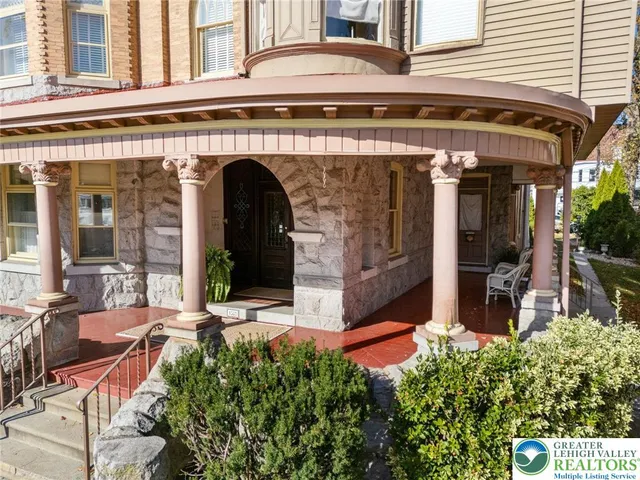a view of living room kitchen and entryway