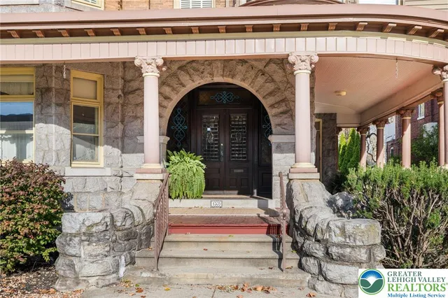 a view of a backyard with sitting area