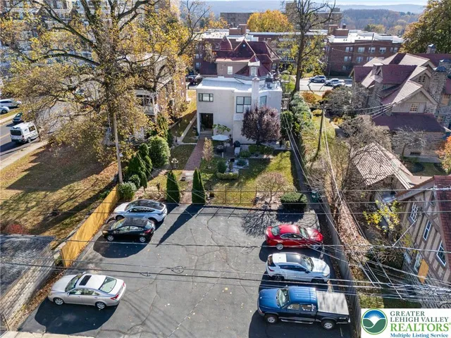 a view of a backyard with sitting area