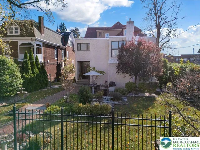 a living room with furniture a rug and a fireplace