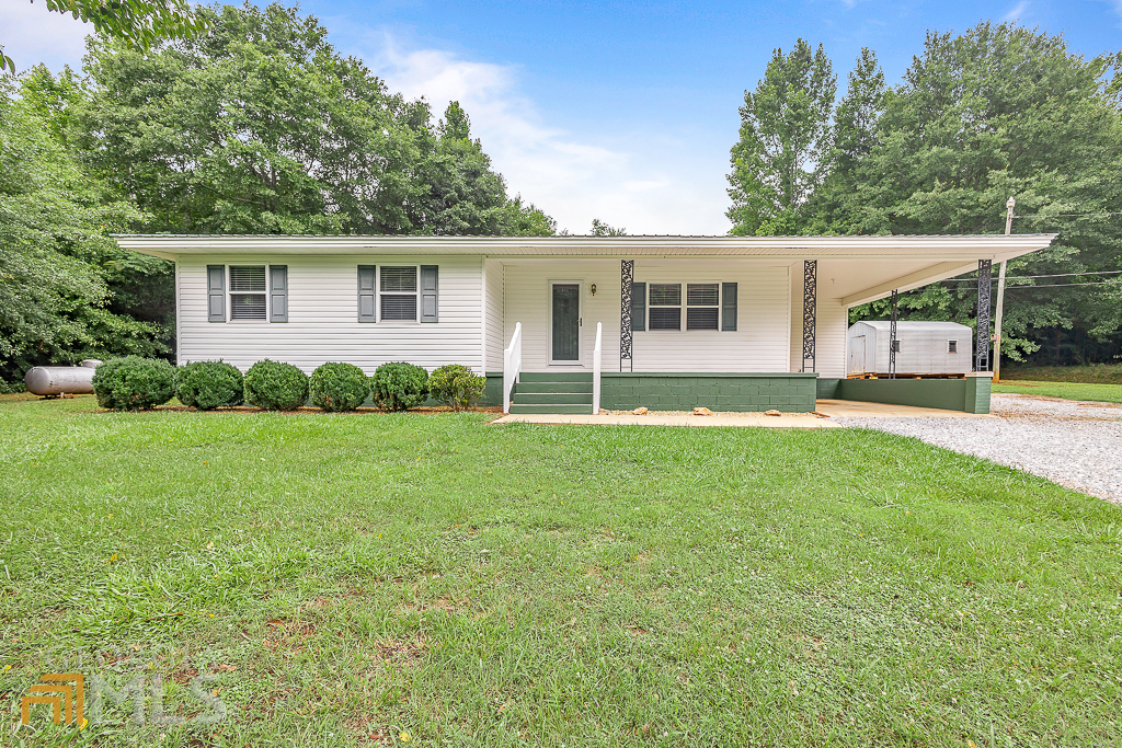 1246 Duncan Bridge Road Cornelia, GA 30531 - Photo 1 of 1 a view of a house with backyard and garden