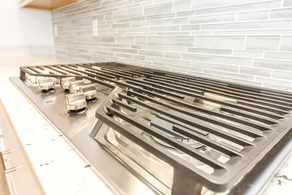 an empty room with a window and a ceiling fan