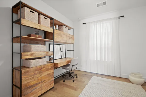 a view of walk in closet with clothes