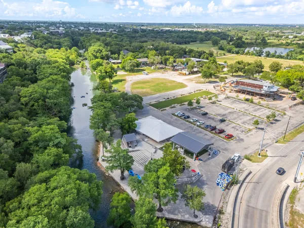 an aerial view of residential houses with outdoor space