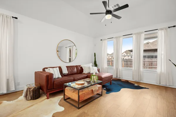 a living room with furniture and a window