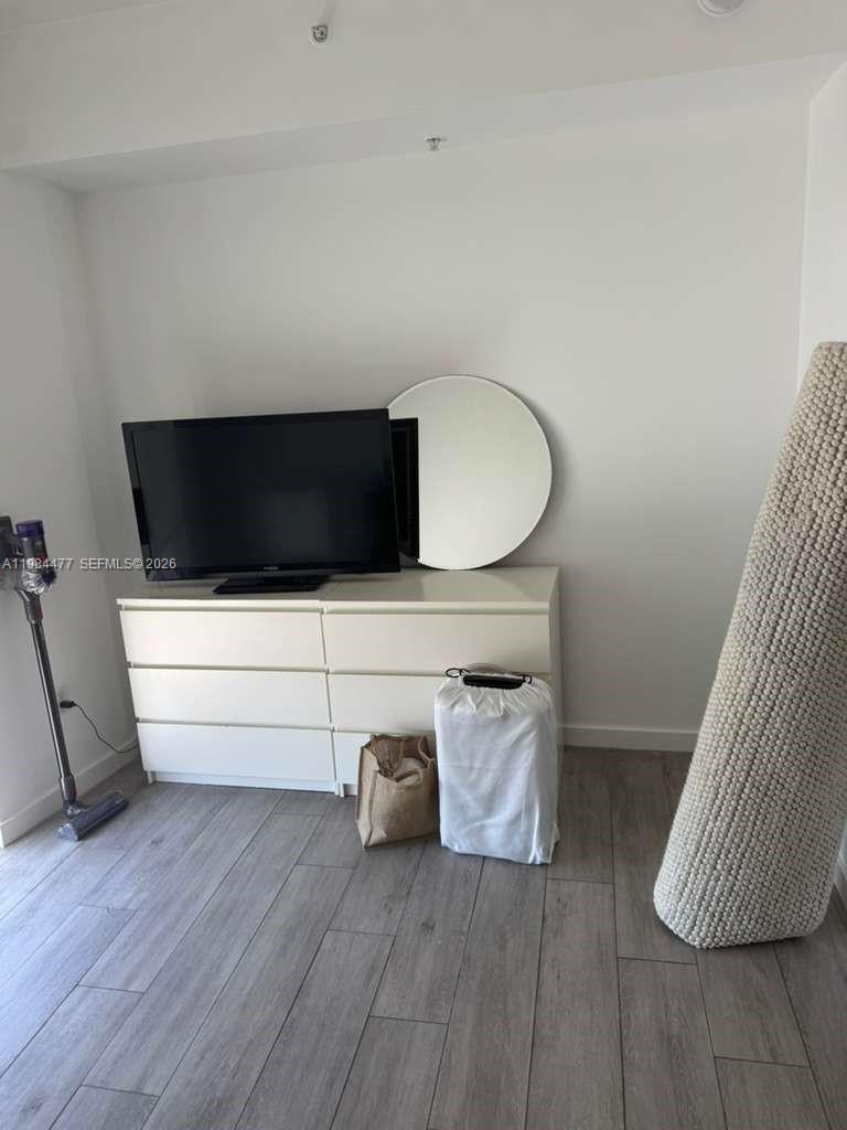 1010 Southwest 2nd Avenue, Unit 1502 Miami, FL 33130 - Photo 11 of 19 a view of living room with furniture and wooden floor