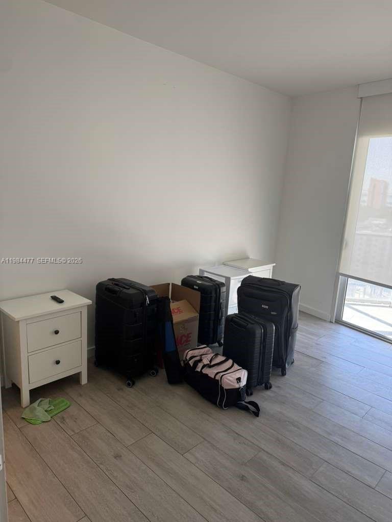 1010 Southwest 2nd Avenue, Unit 1502 Miami, FL 33130 - Photo 12 of 19 wooden floor and windows in a room