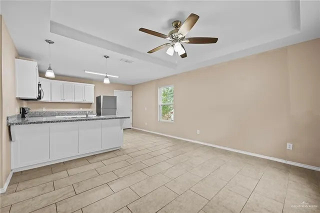 a kitchen with stainless steel appliances cabinets a sink and a counter top space