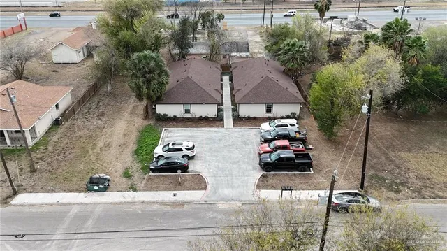 an aerial view of a house with parking space