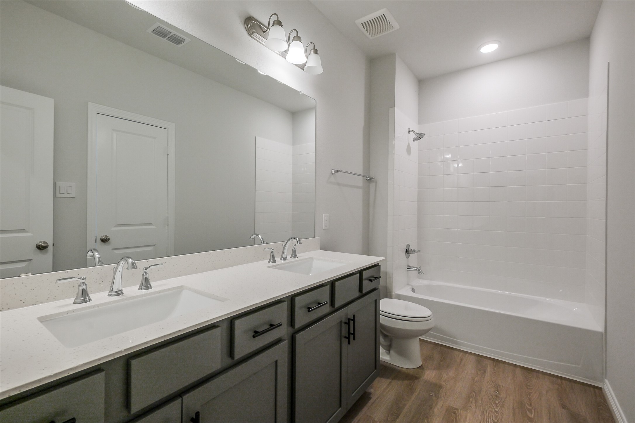 6411 Paris Street Houston, TX 77021 - Photo 21 of 33 a bathroom with a double vanity sink toilet and shower