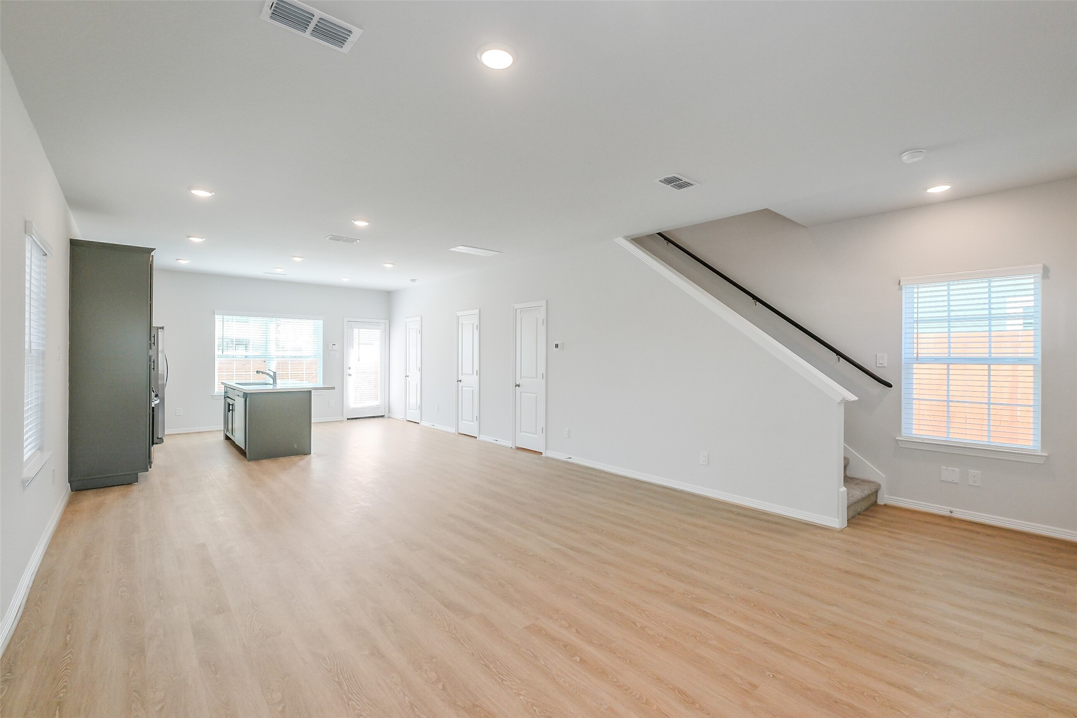 6411 Paris Street Houston, TX 77021 - Photo 8 of 33 a view of a big room with wooden floor and windows