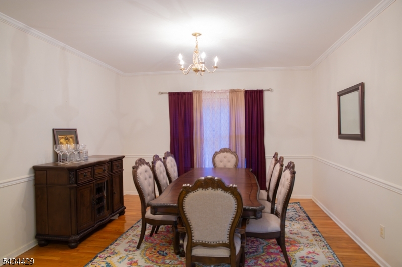 4 Lewis Hollow Road Randolph, NJ 07945 - Photo 3 of 10 a view of a dining room with furniture and chandelier
