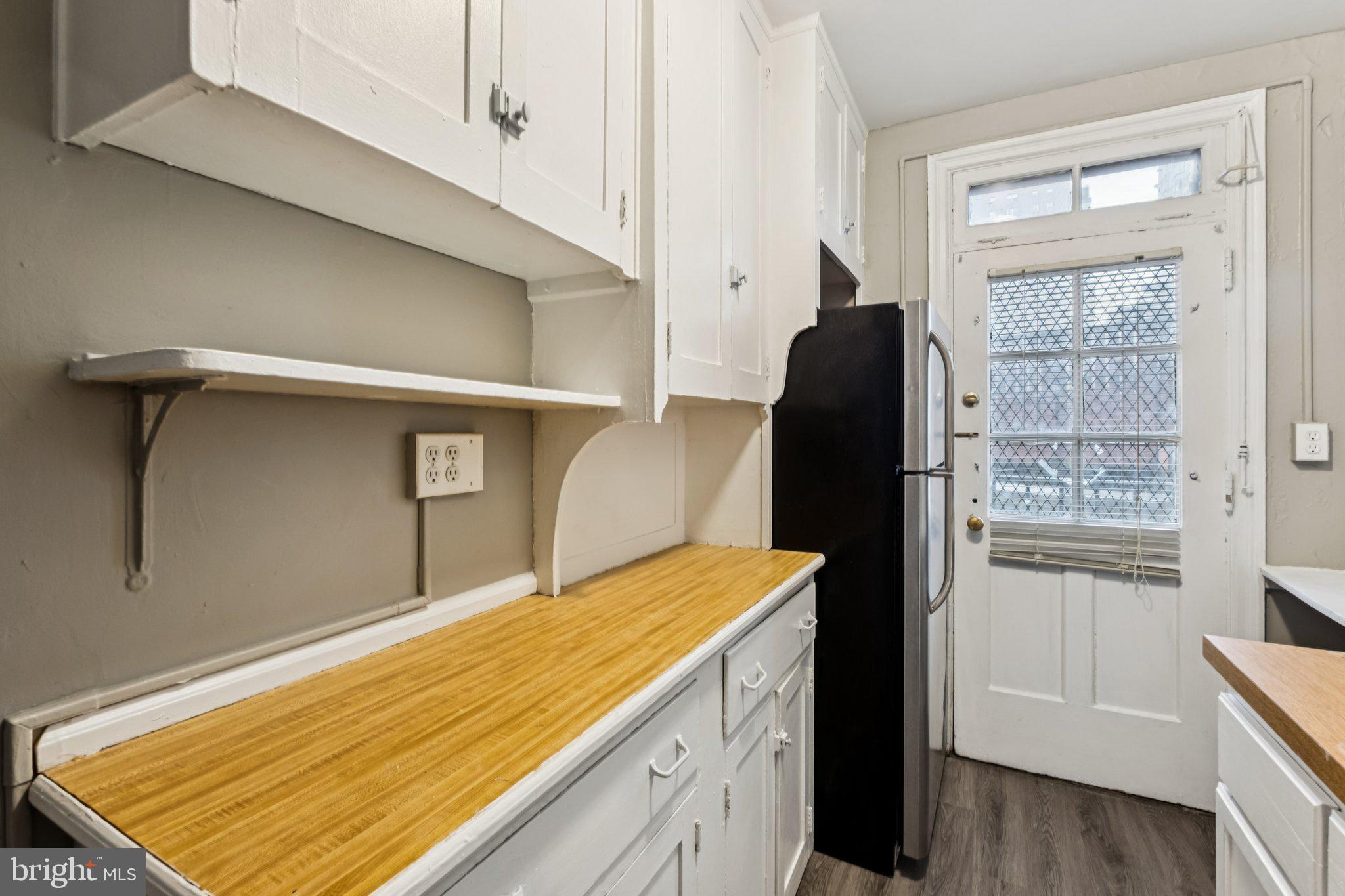 2031 Locust Street, Unit 504 Philadelphia, PA 19103 - Photo 5 of 14 a room with a walk in closet and wooden floor