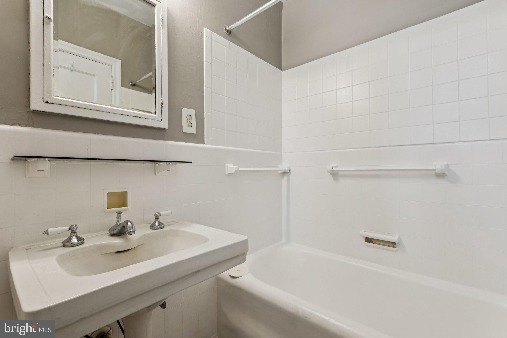 2031 Locust Street, Unit 504 Philadelphia, PA 19103 - Photo 9 of 14 a bathroom with a sink and a bathtub