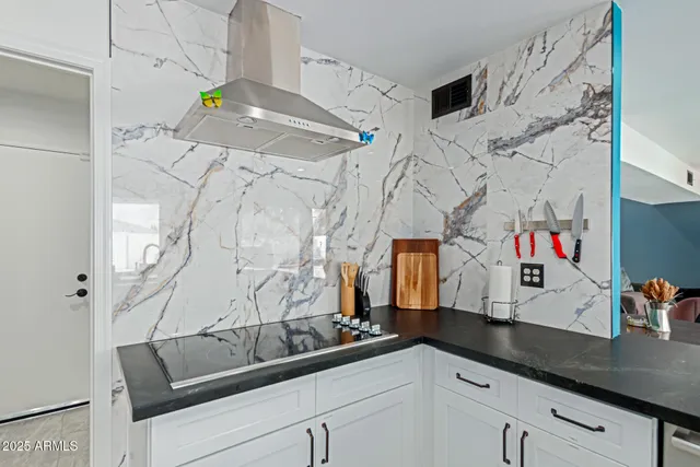 a bathroom with a sink and mirror