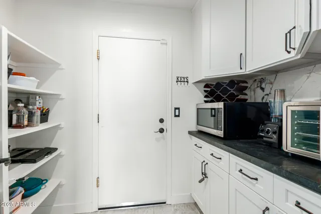 a kitchen with stainless steel appliances a stove and a refrigerator