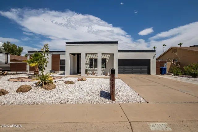 a view of a house with couches in front of house