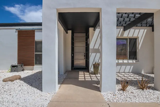 a lobby with furniture and a rug