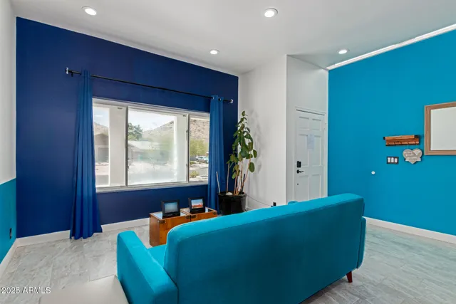 a living room with furniture and a large window