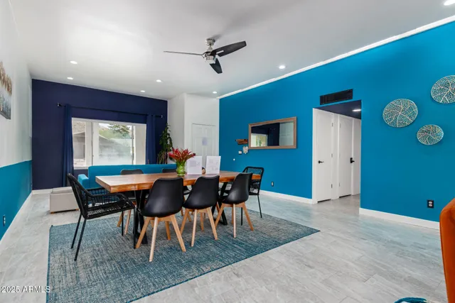 a dining room with furniture and window