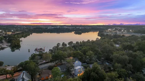 a view of a lake with a building in the background