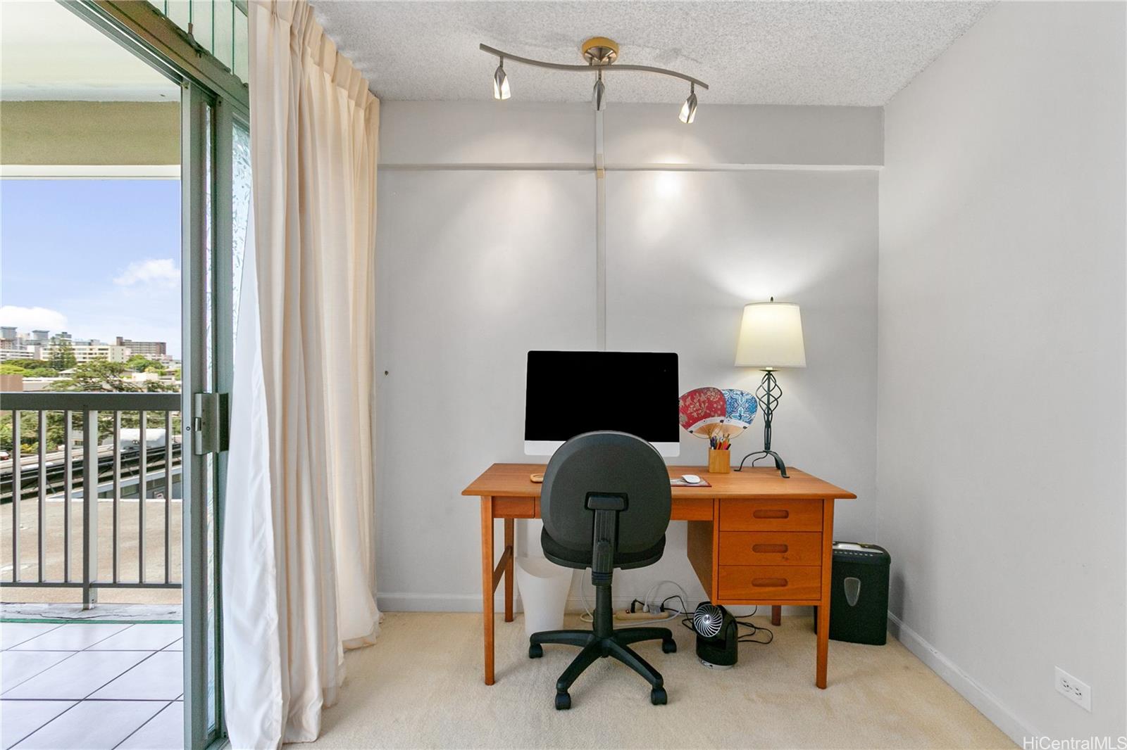 a workspace with furniture and a window