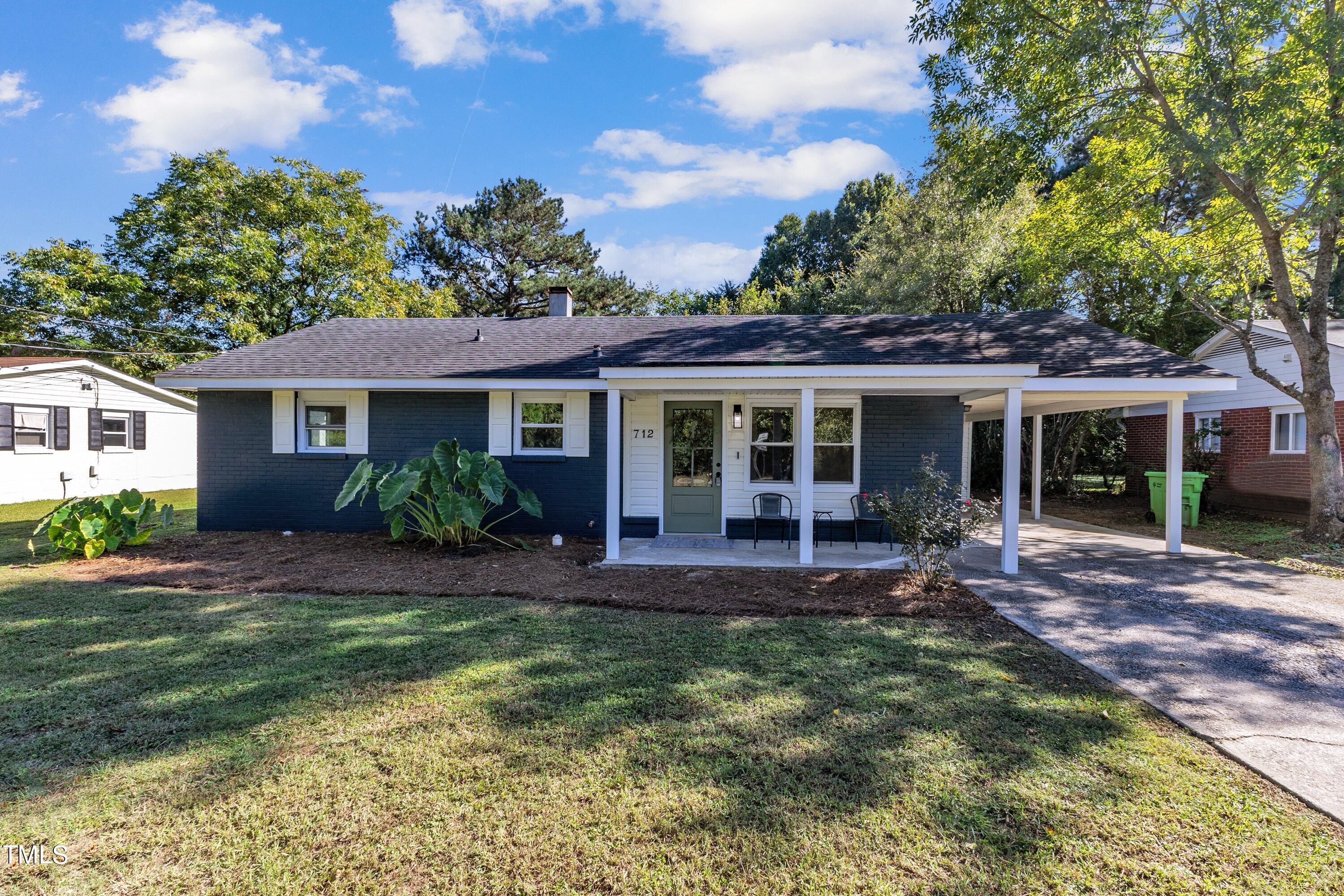 712 Bailey Drive Raleigh, NC 27610 - Photo 1 of 33 a front view of a house with garden and porch