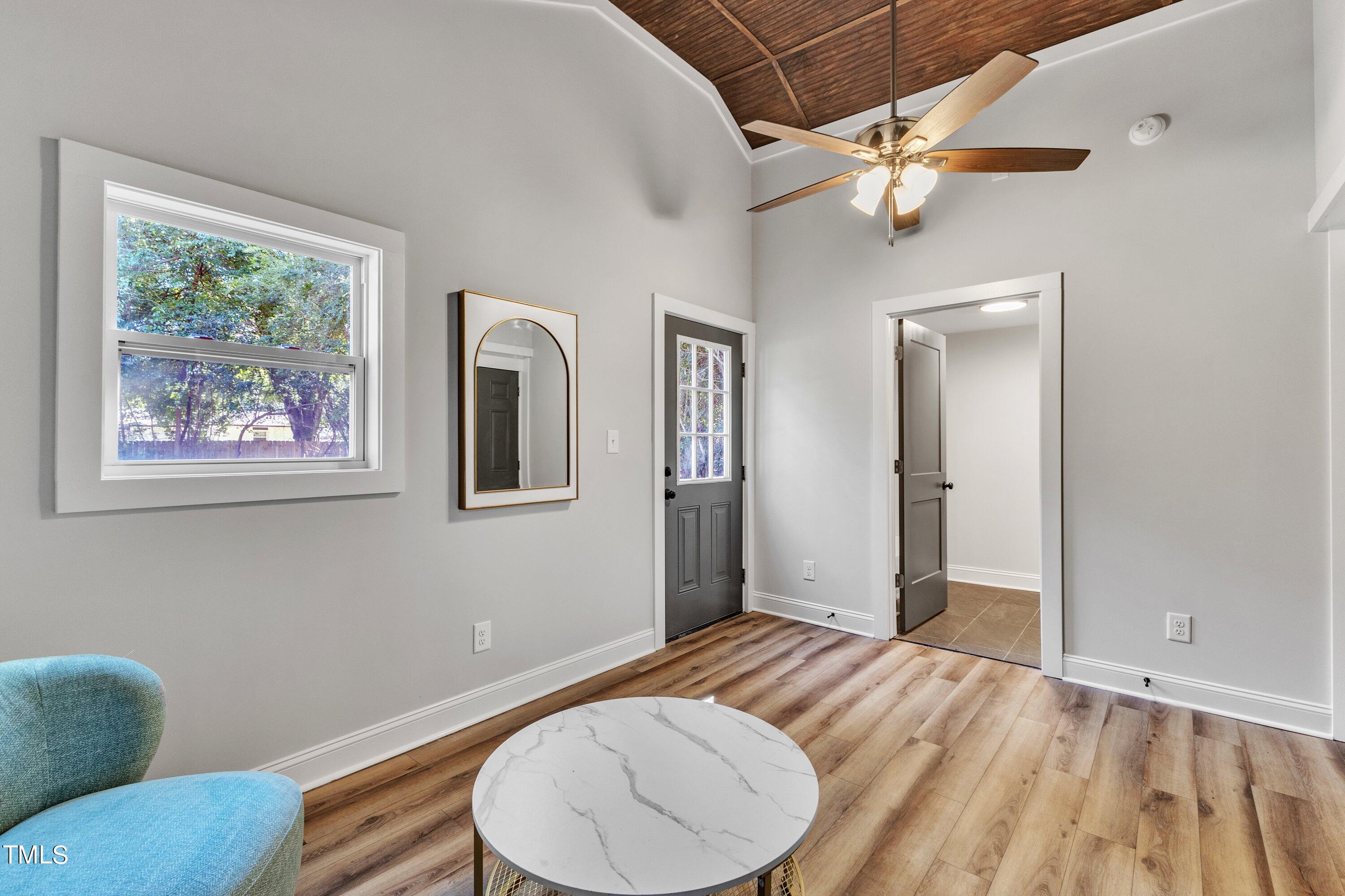712 Bailey Drive Raleigh, NC 27610 - Photo 12 of 33 a bedroom with bed and a chandelier