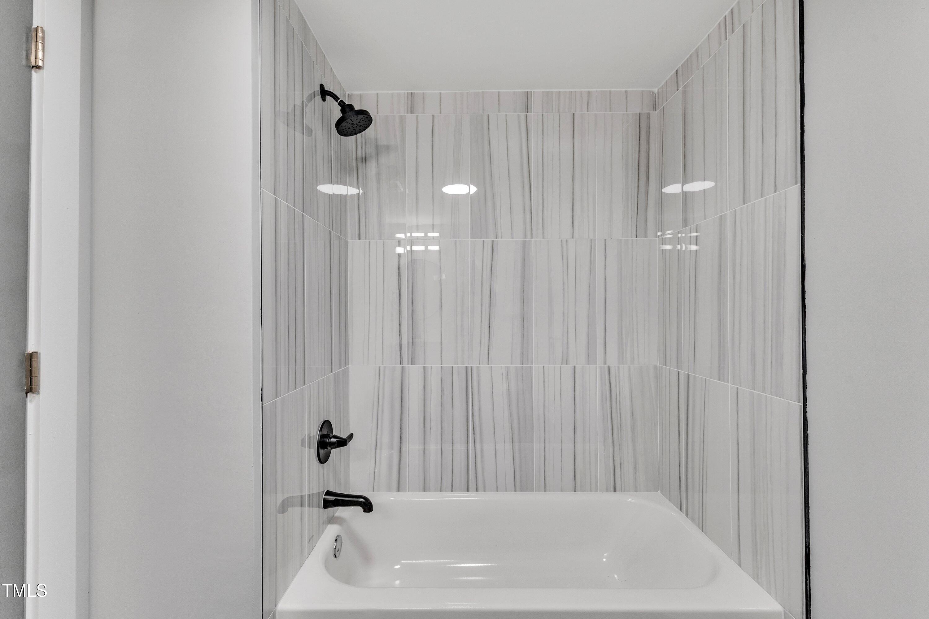 712 Bailey Drive Raleigh, NC 27610 - Photo 16 of 33 a bathroom with a bathtub