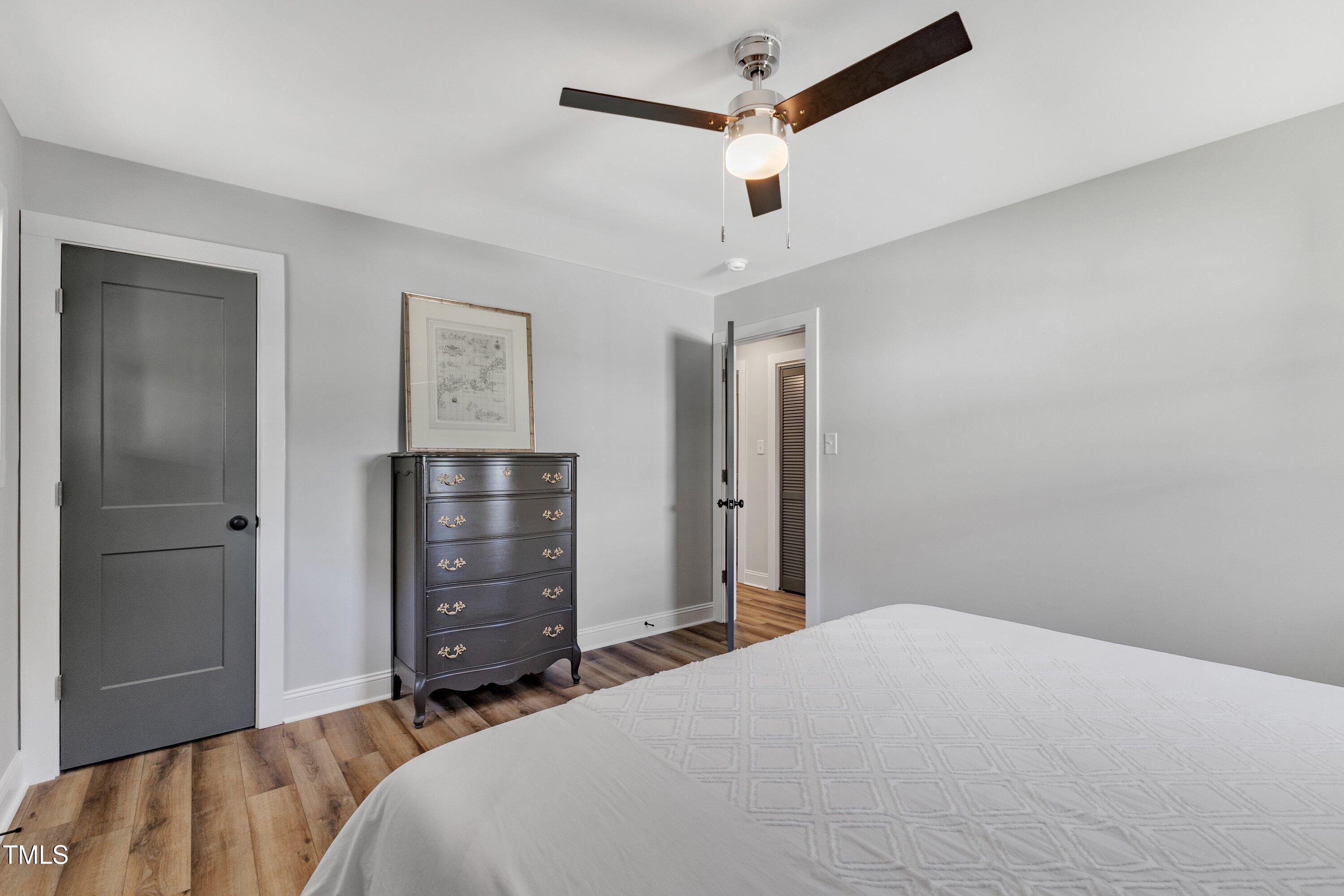 712 Bailey Drive Raleigh, NC 27610 - Photo 19 of 33 a bedroom with a bed and a dresser
