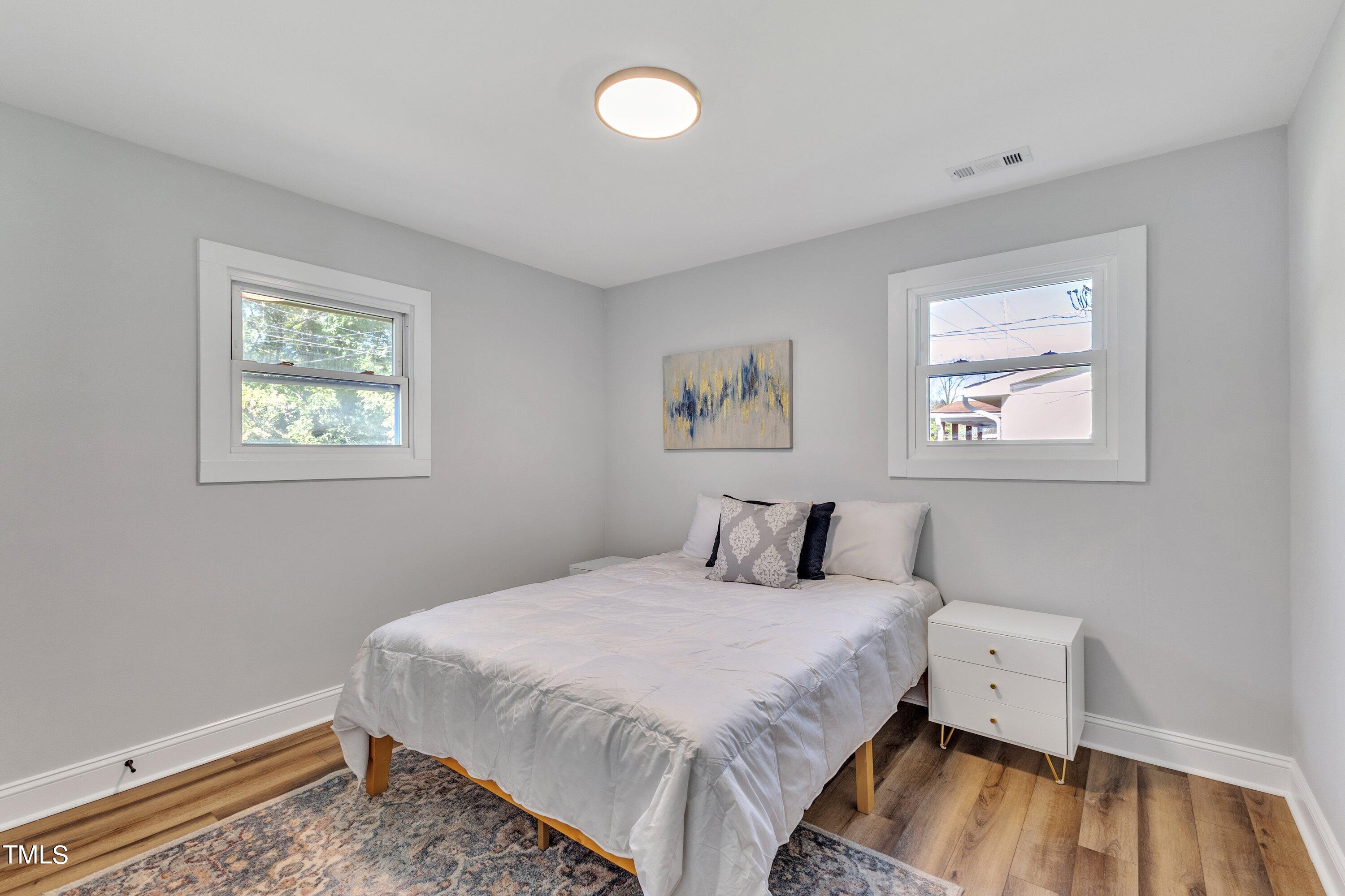 712 Bailey Drive Raleigh, NC 27610 - Photo 20 of 33 a bedroom with a bed and a window