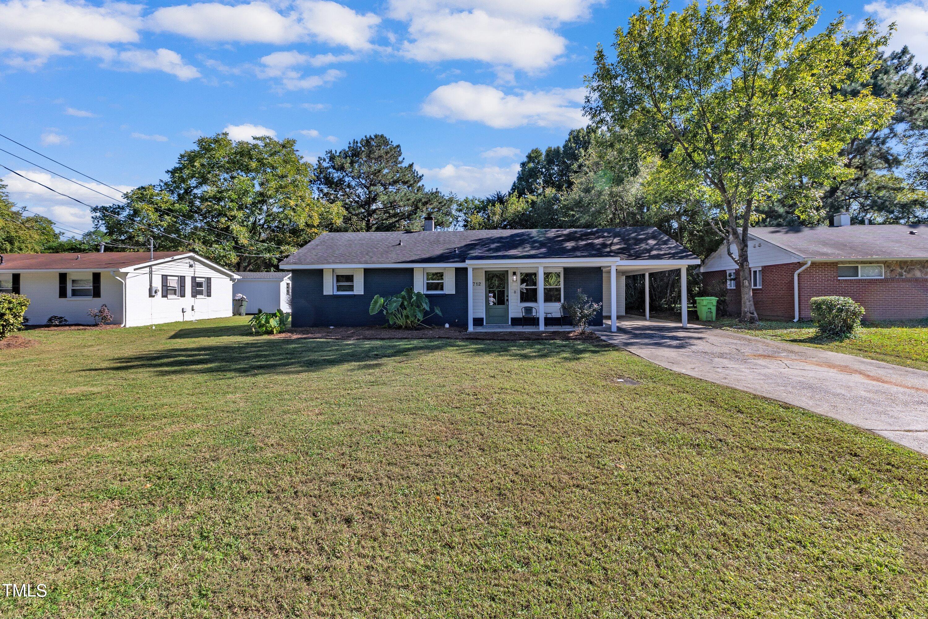 712 Bailey Drive Raleigh, NC 27610 - Photo 2 of 33 a front view of a house with swimming pool having outdoor seating