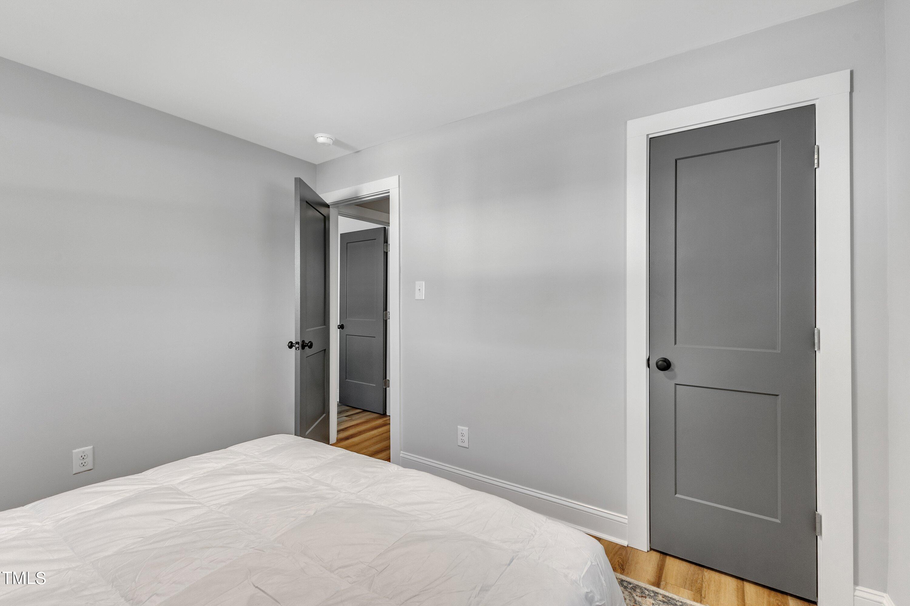712 Bailey Drive Raleigh, NC 27610 - Photo 21 of 33 a bedroom with a bed and hallway